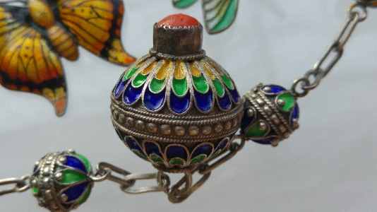 Close up of cloisonn enamel necklace