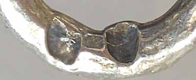 Necklace hallmarks: bulldogs head and leaves on tip of bead hooks