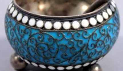 Close up of white cloisonn border and silver beaded wire design