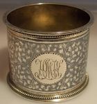 silver napkin ring: illegible master