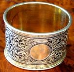 silver napkin ring: illegible master