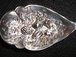 silver plate berry spoon made by J.H. Potter