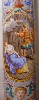 oval scenes on the handle