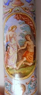 oval scenes on the handle