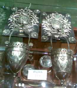 holy water font hanging from their supports
