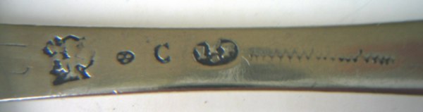 The back of the stem of the previous spoon
