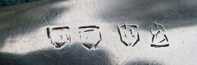 table spoon with bizarre pseudo marks
