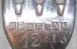 silver fork with seven French marks