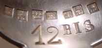 silver fork with seven French marks