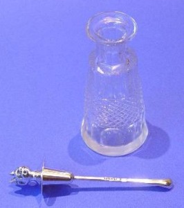Edwardian silver cayenne spoon with its bottle