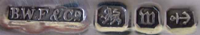 Sponsors mark and hallmarks on the front of the flask