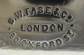 Name and address of the maker stamped on the bottom