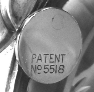 Mechanism for closing and opening a jar, stamped with British patent registration No. 5518