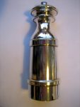 Silvered handheld pepper mill of modern design, made in Italy