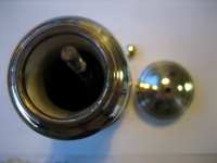 Silvered handheld pepper mill of modern design, made in Italy