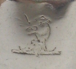 family crest: lion's head stabbed by an arrow