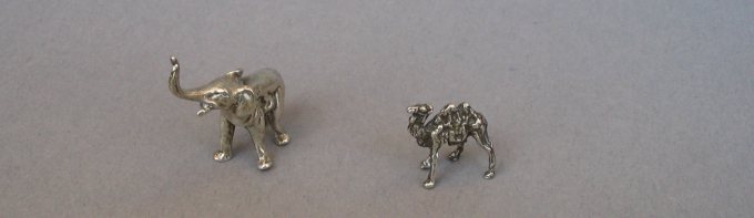 a collection of silver animals