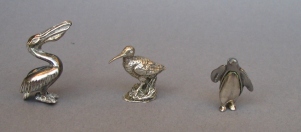 a collection of silver animals