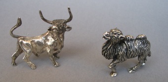 a collection of silver animals