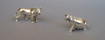 a collection of silver animals