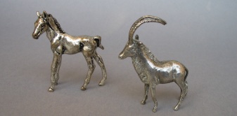 a collection of silver animals