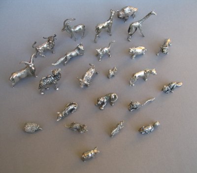 a collection of silver animals