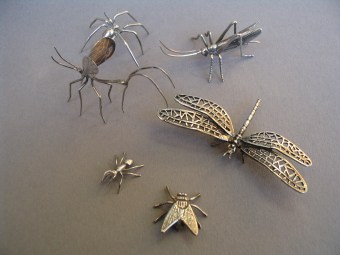 a collection of silver animals