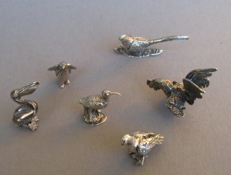 a collection of silver animals