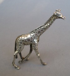a collection of silver animals