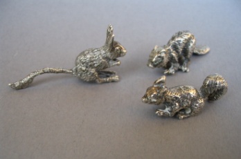 a collection of silver animals