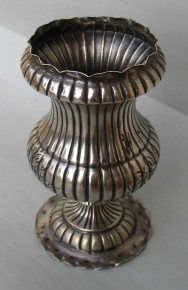 silver vase with floral engraving
