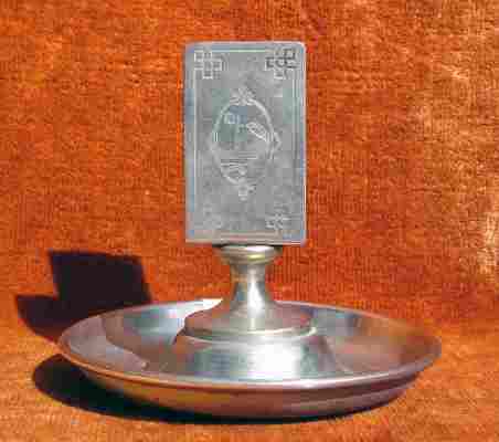 An ash-tray with a match stand made by BMF from pure nickel silver between 1880 and 1887 An ash-tray with a match stand made by BMF from pure nickel silver between 1880 and 1887