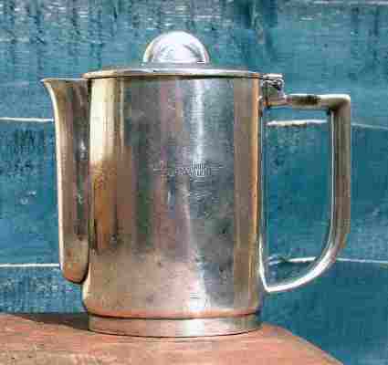 A silver-plated coffee-pot with the logo 'Flug u. Zeppelinhafen-Gastätten' (Plane and Zeppelin Harbour Restaurant), issued by Esslingen BMF branch between 1938 and 1945 A silver-plated coffee-pot with the logo 'Flug u. Zeppelinhafen-Gastätten' (Plane and Zeppelin Harbour Restaurant), issued by Esslingen BMF branch between 1938 and 1945